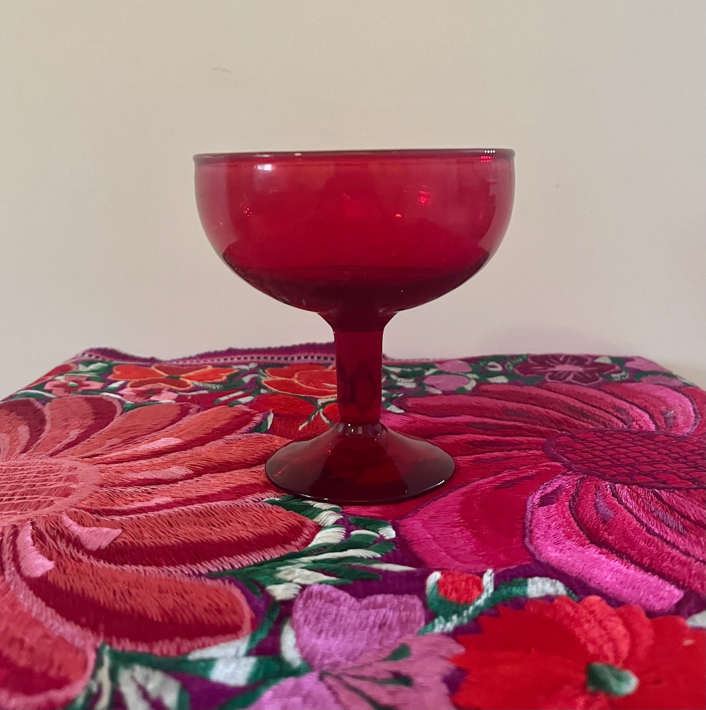 PPD Vintage Red Coupe Glass on floral placemat 